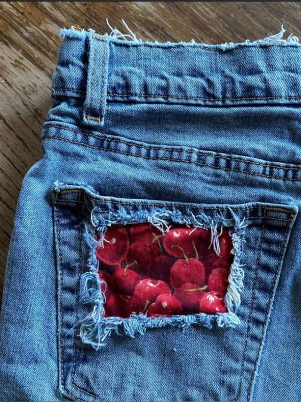 Old Navy vintage light Blue Denim cut off Shorts with Red Cherry Patch
